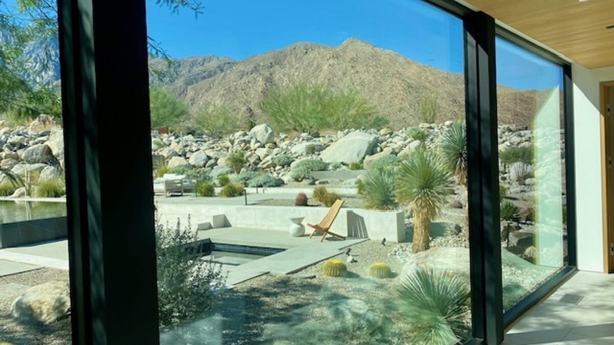 Clean interior glass looking out on a Coachella Valley garden and mountains