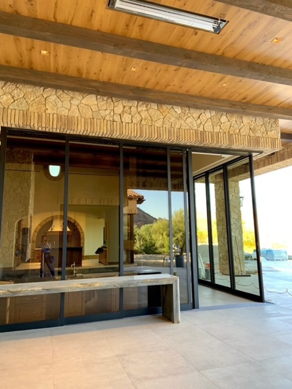 Spanish-style new-build entry and patio, still mid-finish