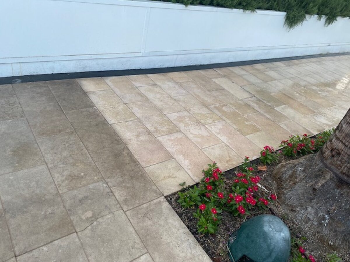 Paver walkway with a clean half and a dirty half