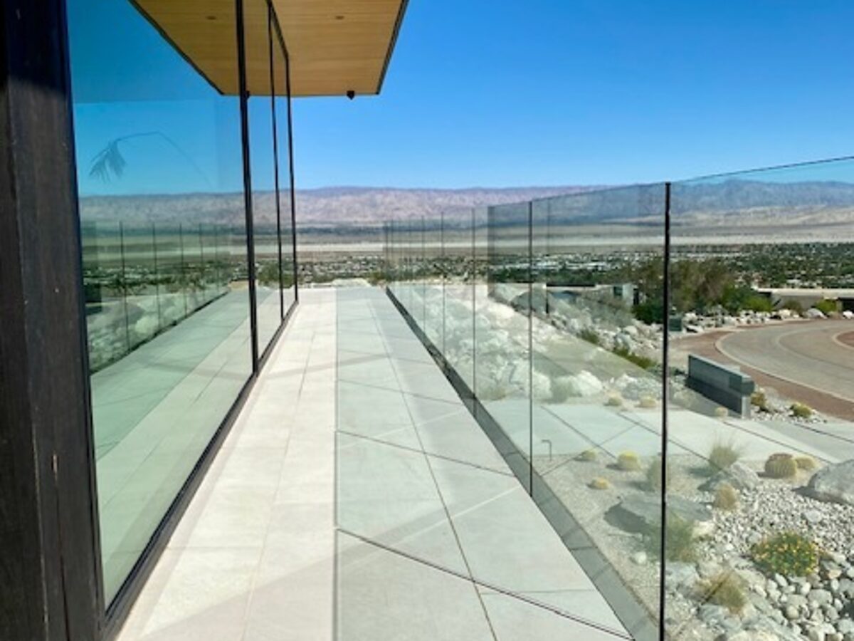 Glass railing walk with desert beyond