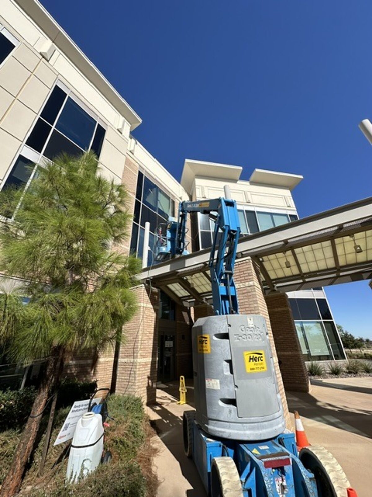 Scissor lift on a commercial glass wall