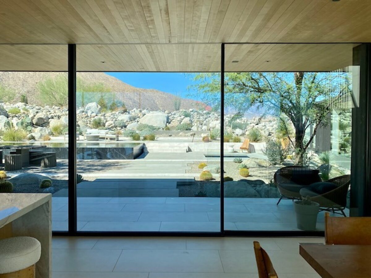 Floor-to-ceiling desert house glass after cleaning